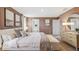 King-size bed in a well lit and spacious Primary bedroom with ensuite access at 5009 Rocky Coast Pl, Palmetto, FL 34221