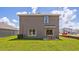 Two-story house with backyard patio, and grassy area at 5009 Rocky Coast Pl, Palmetto, FL 34221