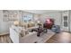 Living room with sofas, coffee table, and TV, decorated with artwork at 5009 Rocky Coast Pl, Palmetto, FL 34221