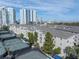 Aerial view of condo building with tennis courts and water views at 501 Knights Run Ave # 2308, Tampa, FL 33602