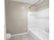 Clean bathroom with white tile and bathtub at 501 Knights Run Ave # 2308, Tampa, FL 33602