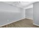 Empty bedroom with gray walls and wood floor at 501 Knights Run Ave # 2308, Tampa, FL 33602