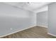 Empty bedroom with gray walls and wood floor at 501 Knights Run Ave # 2308, Tampa, FL 33602