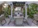Community grilling area with seating for residents at 501 Knights Run Ave # 2308, Tampa, FL 33602