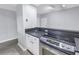 Modern kitchen with stainless steel appliances and white cabinets at 501 Knights Run Ave # 2308, Tampa, FL 33602