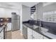 Modern kitchen with stainless steel appliances and white cabinets at 501 Knights Run Ave # 2308, Tampa, FL 33602