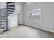 Living room with spiral staircase and wood floors at 501 Knights Run Ave # 2308, Tampa, FL 33602