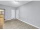 Spacious living room with gray walls and wood-look floors at 501 Knights Run Ave # 2308, Tampa, FL 33602