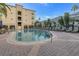 Inviting community pool with surrounding lounge chairs at 501 Knights Run Ave # 2308, Tampa, FL 33602