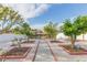 Landscaped backyard with a pathway, garden beds, and a view of the water at 6512 Manila Palm Way, Apollo Beach, FL 33572
