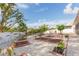 Private backyard with white fence, garden beds, and various plants at 6512 Manila Palm Way, Apollo Beach, FL 33572