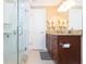 Bathroom featuring glass shower, wood vanity, and granite counter at 6512 Manila Palm Way, Apollo Beach, FL 33572