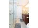 Clean bathroom with a glass shower and wooden vanity at 6512 Manila Palm Way, Apollo Beach, FL 33572