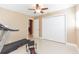 Bedroom with white closet doors and exercise equipment at 6512 Manila Palm Way, Apollo Beach, FL 33572