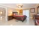 Inviting bedroom with wooden furniture, ceiling fan, and neutral decor at 6512 Manila Palm Way, Apollo Beach, FL 33572