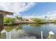 Dock on the canal with views of neighboring houses and lush greenery at 6512 Manila Palm Way, Apollo Beach, FL 33572