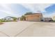 View of home's exterior with attached garage, driveway, and landscaping at 6512 Manila Palm Way, Apollo Beach, FL 33572