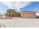 Single-story home with attached garage, arched entryway, and landscaped yard at 6512 Manila Palm Way, Apollo Beach, FL 33572