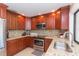 Updated kitchen with stainless steel appliances, granite countertops, and plenty of cabinet space at 6512 Manila Palm Way, Apollo Beach, FL 33572