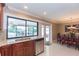 Kitchen with granite countertops, wood cabinets, and access to the backyard at 6512 Manila Palm Way, Apollo Beach, FL 33572