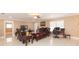 Living area with ample seating, a ceiling fan, and a designated workspace at 6512 Manila Palm Way, Apollo Beach, FL 33572