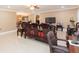 Living room featuring ornate furniture, tile floors, and a designated workspace at 6512 Manila Palm Way, Apollo Beach, FL 33572