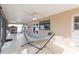 Covered patio with hammock and outdoor furniture at 6512 Manila Palm Way, Apollo Beach, FL 33572