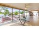 Screened patio with hammock, tropical plants, and water view at 6512 Manila Palm Way, Apollo Beach, FL 33572