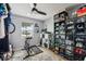 Home gym with exercise bike, treadmill, and ample storage at 7402 Sherren Dr, Tampa, FL 33619