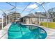 Large, kidney-shaped pool with screened enclosure at 8551 Linebrook Dr, Trinity, FL 34655