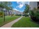 Landscaped grounds with a paved walkway and lush greenery at 90 S Highland Ave # 416, Tarpon Springs, FL 34689