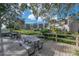 Community patio with lake view and picnic tables at 90 S Highland Ave # 416, Tarpon Springs, FL 34689