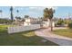 House exterior view, showcasing landscaping and a circular driveway at 15825 Redington Dr, Redington Beach, FL 33708