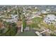 Aerial view of a waterfront community showing a house and private dock at 15825 Redington Dr, Redington Beach, FL 33708