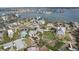 Aerial view of a waterfront home with a private dock and surrounding houses at 15825 Redington Dr, Redington Beach, FL 33708