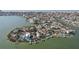 Aerial view of a waterfront community with lush landscaping at 15825 Redington Dr, Redington Beach, FL 33708