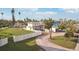 Aerial view showing home's exterior, landscaping, and circular driveway at 15825 Redington Dr, Redington Beach, FL 33708