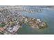 Wide aerial showcasing waterfront homes and the surrounding neighborhood at 15825 Redington Dr, Redington Beach, FL 33708