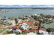Aerial view showcasing a house, pool, and waterfront location at 15825 Redington Dr, Redington Beach, FL 33708