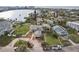 Aerial view of waterfront home with large lot and circular driveway at 15825 Redington Dr, Redington Beach, FL 33708