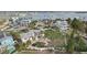 Aerial view of waterfront property with surrounding homes and lush landscaping at 15825 Redington Dr, Redington Beach, FL 33708