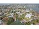 Aerial view of a neighborhood with a waterfront property and boat dock at 15825 Redington Dr, Redington Beach, FL 33708