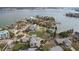 Aerial view of a waterfront property with a large lot and neighboring houses at 15825 Redington Dr, Redington Beach, FL 33708