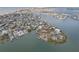 Aerial view of a waterfront community with many houses and boats at 15825 Redington Dr, Redington Beach, FL 33708