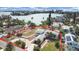 Aerial view of a waterfront home with a large lot and circular driveway at 15825 Redington Dr, Redington Beach, FL 33708
