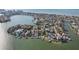 Wide aerial showcasing waterfront homes and canals at 15825 Redington Dr, Redington Beach, FL 33708