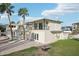 Back exterior of house with balcony, patio, and fire pit at 15825 Redington Dr, Redington Beach, FL 33708