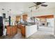 Kitchen with wood cabinets, granite countertops, and an island at 15825 Redington Dr, Redington Beach, FL 33708