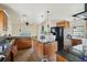 Kitchen with wood cabinets, granite countertops and an island, needing updating at 15825 Redington Dr, Redington Beach, FL 33708