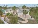 Home's backyard with pool, patio, and palm trees at 15825 Redington Dr, Redington Beach, FL 33708